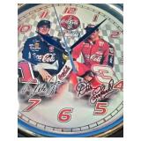 This vintage Coca-Cola NASCAR Dale Earnhardt Sr. and Jr. wall clock features signature branding and a glass lens.