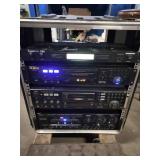 This is a professional karaoke equipment rack containing various audio components.