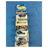 Assortment of vintage sealed Hot Wheels die-cast cars from the late 1990s and early 2000s,