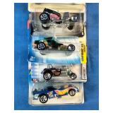 Assortment of vintage sealed Hot Wheels die-cast cars from the late 1990s and early 2000s,
