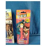 Three vintage, carded PEZ candy dispensers from different classic sets still sealed in their original blister packs: