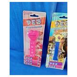 Three vintage, carded PEZ candy dispensers from different classic sets still sealed in their original blister packs: