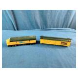 HO Scale models of a Chicago and North Western Railway F7 diesel locomotive and matching box car.