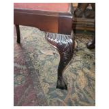 Beautifully Carved Wooden Dining Table with Winged Lion Base and Round Glass Top