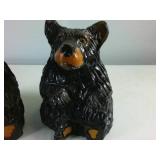 Two hand carved sitting black bears painted with gloss finish