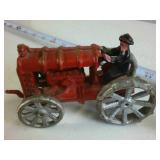 Lot of (2) Cast Iron Collectibles: Farmer on Tractor and Nutcracker