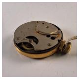 New Haven compensated pocket watch features a weathered geometric face and a gold-tone case