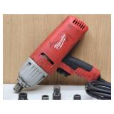 Milwaukee Electric Impact Wrench with Assorted Sockets