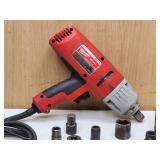 Milwaukee Electric Impact Wrench with Assorted Sockets