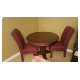 Cherry Tone Round Table and Two Burgundy Upholstered Chairs