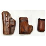 Many leather holsters