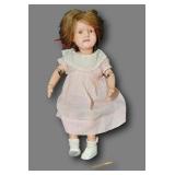 antique wooden doll with hinged limbs and possibly human hair