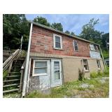Studio Home with 20x40 Garage/Workshop on .66 +/- Acre 