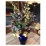 Elegant silk floral arrangement blue glass vase