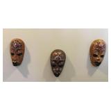 Hanging African mask trio