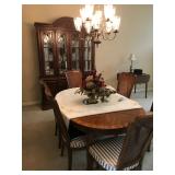 Nice pecan table with 8 chairs, 2 leafs, and table pads