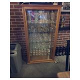 Oak Glass Display Cabinet, has 5 glass shelves opens on sides, Lighted, 14"D, 31"L, 60"T - $125.00