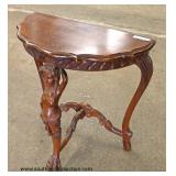  SOLID Mahogany Hand Carved Figural Half Moon Table  Auction Estimate $100-$300 – Located Inside 