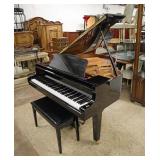 Single Owner 1998 Yamaha Baby Grand Piano bought new, Model GP1 PE in the high gloss black lacquer with storage bench with original paperwork approx. Piano; 59" w x 63" d x 39" h Bench: 30" w x 14" d 