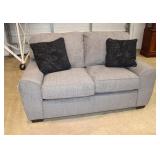  Lot 155 New Lane 2 cushion upholstered loveseat with pillows in the soft grey