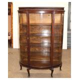  Lot 168 Antique oak curved glass china cabinet with original wooden shelves, missing the mirror bac