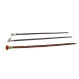  Lot 711 3 walking sticks (Canes) 1 carved with amber glass handle and more