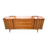  Lot: 101 - MCM United walnut low chest with fitted interior and cats eye style pulls