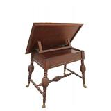 Lot 127: Nice Lane furniture National Geographic Home Design mahogany finished 1 drawer desk tilt top drafting table with brass claw feet in good condition, 42"w x 29"d x 34"h 