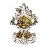 Lot 753: Large porcelain clock with cherubs and flowers, key and pendulum, working unknown, signed Meissen with crossed swords