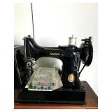small Singer machine with all attachments