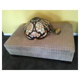 Storage Ottoman, 53” L x 31” D x 17” H, and Stained Glass Chandelier, measures 24” across