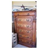 Tall dresser and model plane