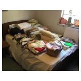 Bed w/ various linens