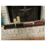 Lionel train with a box of tracks