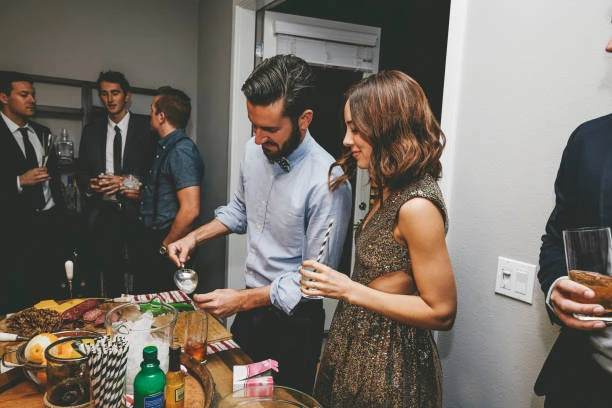 two people enjoying a cocktail party