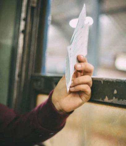 man holding printable ticket 