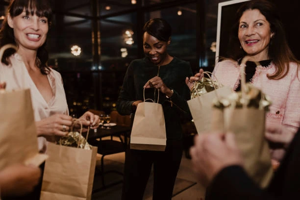 women receiving gift bags at event 