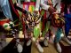 Men hold traditional devil masks during Corpus Christi mass celebrations at the San Atanacio church in La Villa