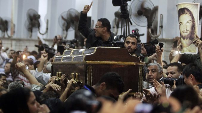 Man shouts during funeral for victim of attack outside Coptic Orthodox church in Cairo