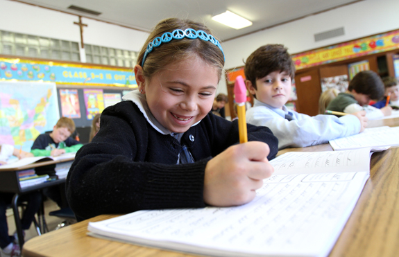 GIRL SMILES AT NEW YORK SCHOOL AFTER CLASSES RESUME FOLLOWING HURRICANE SANDY