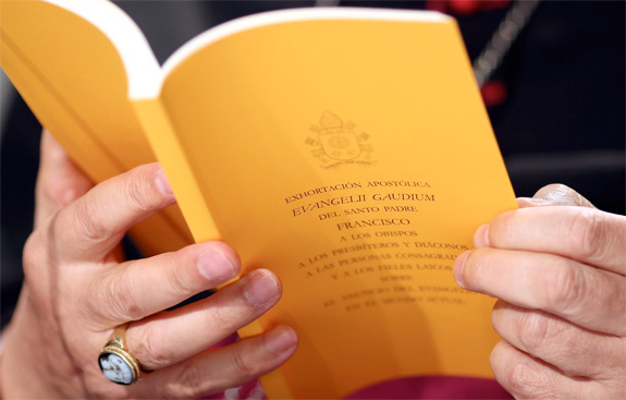 A copy of the apostolic exhortation 'Evangelii Gaudium' ('The Joy of the Gospel') by Pope Francis is seen during a news conference at the Vatican Nov. 26. (CNS photo/Alessandro Bianchi