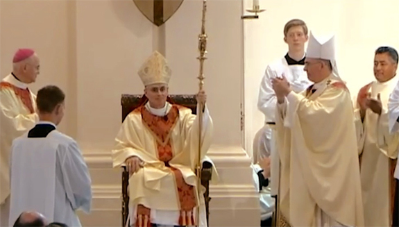 bishop thomas a. daly receives his cathedra at his installation mass at our lady of lourdes cathedral