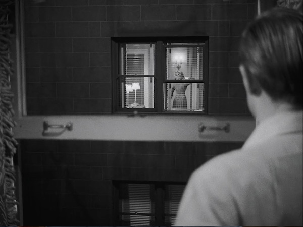 Jed (Richard Widmark) watches Nell in Don’t Bother to Knock.