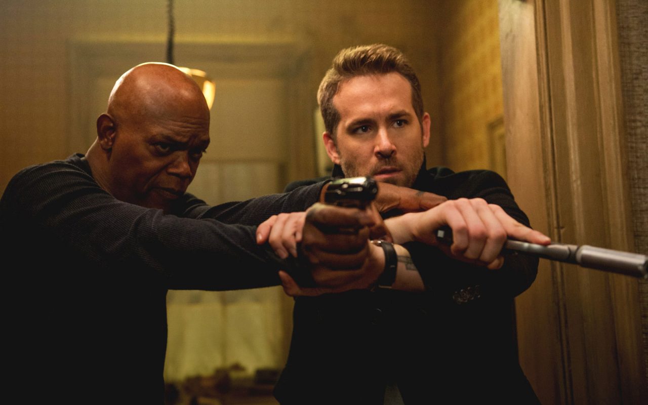 Geek Girl Authority Movie Review Hitman's Bodyguard Samuel L. Jackson as Darius Kinkaid and Ryan Reynolds as Michael Bryce