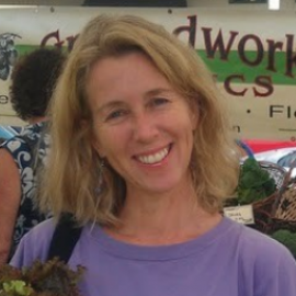 Alissa Keny-Guyer at farmer's market in lavendar shirt