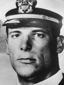 Attached photograph of Commander Arnold