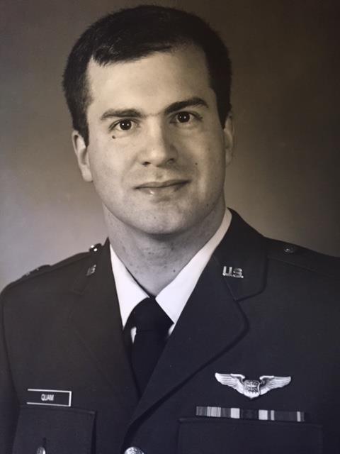 Attached photograph of Captain Quam