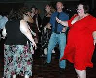 fat women with no core strength dancing in a studio