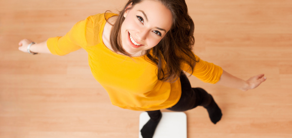 Portrait,Of,Young,Brunette,Beauty,Using,Household,Scale.