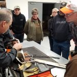 Class learning parts of a chainsaw